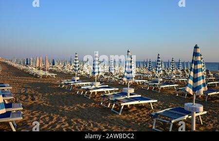 umbrellas still closed early in the morning Stock Photo