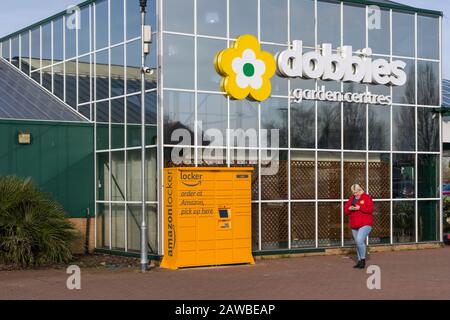 Amazon online pick-up locker, named Yula, outside Dobbies Garden Centre, Wootton, Northampton, UK Stock Photo