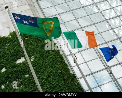 Irish flags fluttering in wind. Dublin City Centre. Flags of Dublin Ireland and EU fluttering in wind. Stock Photo