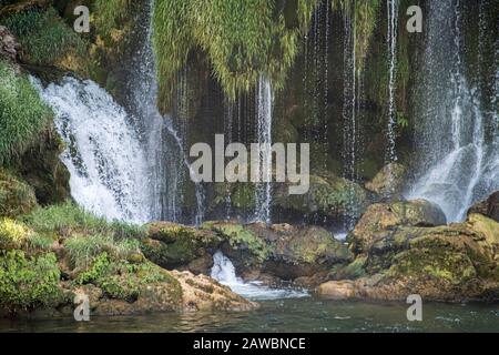 Bosnia and Herzegovina, Kravica Waterfalls - June 2018: Popular with tourists Kravica waterfall is a large tufa cascade on the Trebižat River, in the Stock Photo