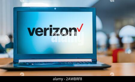 POZNAN, POL - DEC 11, 2019: Laptop displaying logo of Verizon Communications Inc., an American multinational telecommunications conglomerate Stock Photo