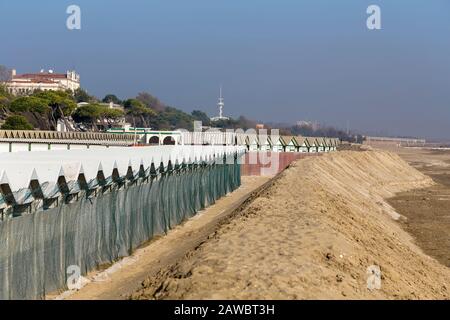 Deserted beach with small beach houses on the island of Lido in Venice. Italy Stock Photo