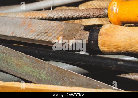Pile of the old rasps. different carpentry files. various graters. instrument for wood processing. hand tools Stock Photo
