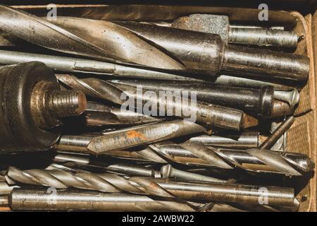 Different drills in a box. pile of drill bits in a case. working tools Stock Photo