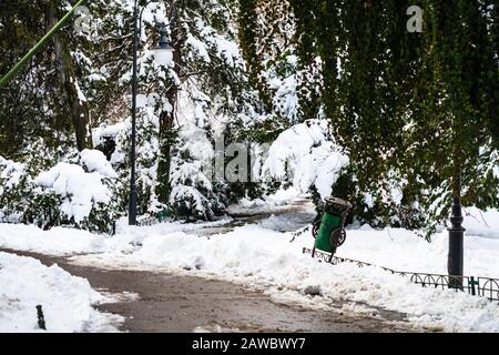 Path way made by people walking thru the snow in the park. Path in heavy snow. Winter concept snow-path in the evening light Stock Photo