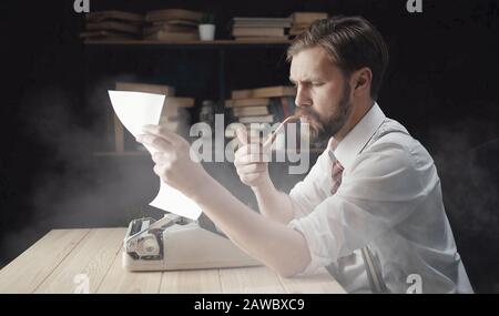Novelist looking at typescript Stock Photo