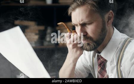 Smoked reading man portrait Stock Photo