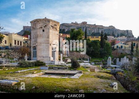 Tower of the Wind-gods in Roman Agora and Acropolis in the background shot on a winter afternoon Stock Photo