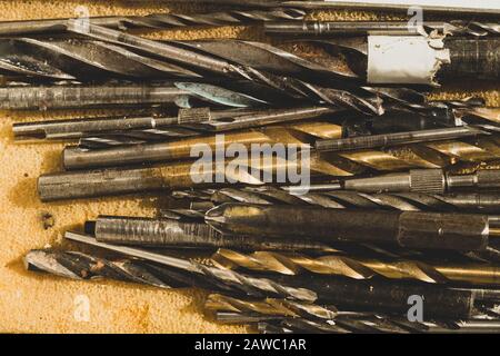 Different drills in a box. pile of drill bits in a case. working tools Stock Photo