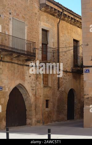 The Renaissance town hall and surrounding cobbled streets of Arnes, a medieval fortified town in Els Ports natural park, Catalonia Stock Photo