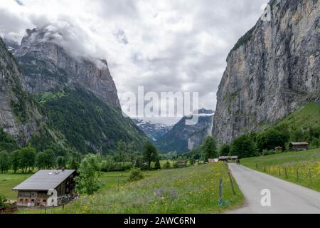 Road through the Waterfalls Valley in Lauterbrunnen Switzerland Stock Photo