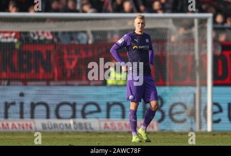 08 February 2020, Lower Saxony, Osnabrück: Football: 2nd Bundesliga, VfL Osnabrück - 1 FC Nürnberg, 21st matchday in the stadium at Bremer Brücke. Osnabrück's Lukas Gugganig was disappointed after the goal against to make it 1-0. Photo: Friso Gentsch/dpa - IMPORTANT NOTE: In accordance with the regulations of the DFL Deutsche Fußball Liga and the DFB Deutscher Fußball-Bund, it is prohibited to exploit or have exploited in the stadium and/or from the game taken photographs in the form of sequence images and/or video-like photo series. Stock Photo