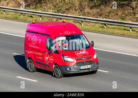 Red Ford Transit Custom 290 Eco-TE; Vivid Virgin Media; UK Vehicular traffic, transport, modern, van on the M61 motorway highway. UK Stock Photo