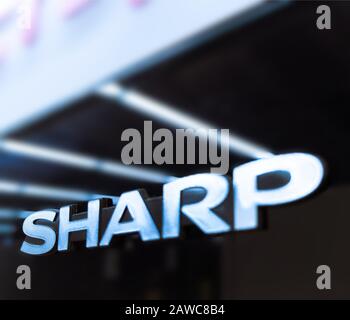 logotype of the Sharp corp, placed on storefront Stock Photo