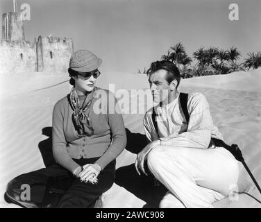 GARY COOPER visited by his wife SANDRA SHAW aka VERONICA BALFE aka ROCKY COOPER on set location candid in Yuma Arizona during filming of  BEAU GESTE 1939 director WILLIAM A. WELLMAN novel P.C. WREN Paramount Pictures Corporation Stock Photo