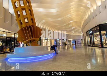 An empty shopping mall in the interior of the O2 Millennium Dome in North Greenwich London Stock Photo