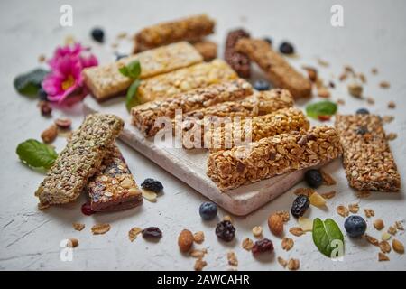 Various kinds of protein granola bars with dry fruits and berries Stock Photo