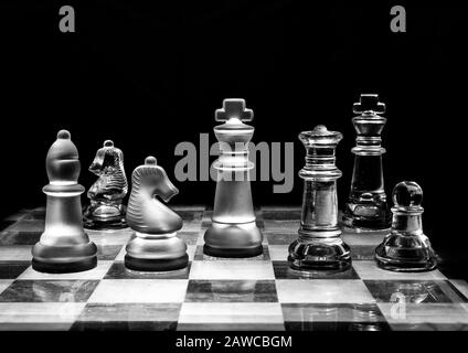 Stylised chess pieces on chess board. Stock Photo