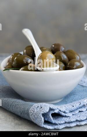 Green olives and olive oil, healthy eating, cooking ingredients Stock Photo