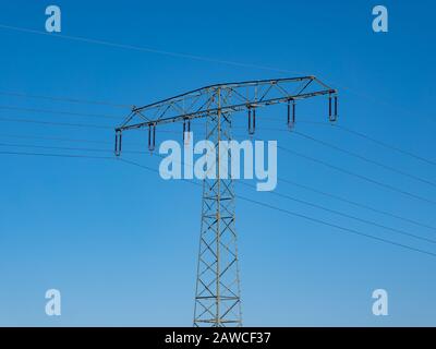 Electricity pylon with blue sky Stock Photo