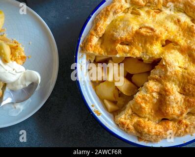 Apple Pie or Tart with Slice of Pie on a Plate Stock Photo
