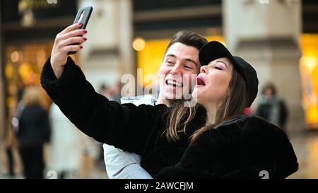 Couple of turists taking a selfie in the city Stock Photo