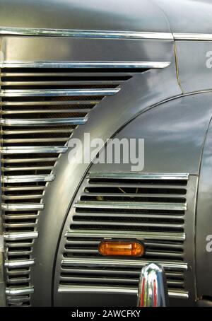 A close up abstract view of the front grill on an old scrap car Stock Photo