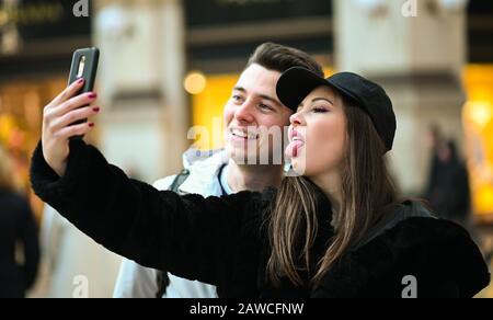 Couple of turists taking a selfie in the city Stock Photo