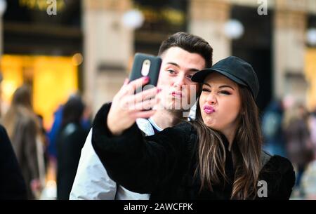 Couple of turists taking a selfie in the city Stock Photo