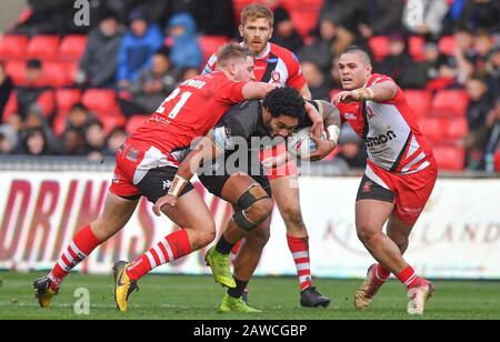 Toronto Wolfpack's Ricky Leutele is tackled by Salford Red Devils' James Greenwood during the Betfred Super League match at the AJ Bell Stadium, Salford. Stock Photo