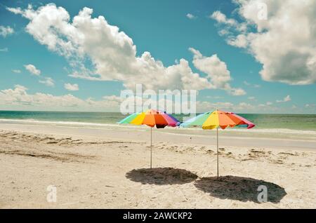 Two Beach Umbrellas on the Sandy Coastline of Anna Maria Island Stock Photo