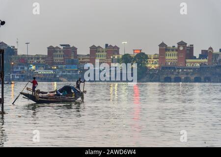 Traditional wooden fishing boat in river Hooghly or Ganga in evening. Kolkata. India Stock Photo