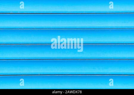 Background and texture of metal gates in blue. Close up. Stock Photo