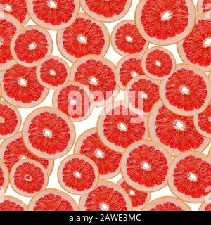 Seamless pattern of red grapefruit slices on white background. Stock Photo
