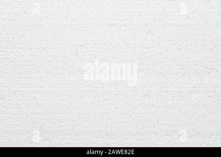 White abstract polystyrene foam texture background. Close-up detail view of styrofoam, plastic sheet, polystyrene abstract synthetic packaging materia Stock Photo