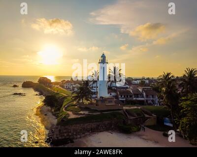 Sunset at the dutch fort lighthouse at Galle in Sri Lanka Stock Photo