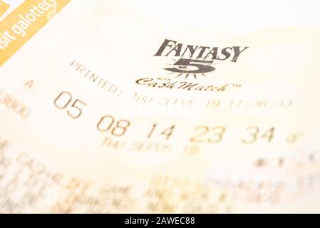 Vidalia, Georgia / USA - September 9, 2019: A close-up studio shot of the Georgia Fantasy 5 yellow lottery printout ticket. Stock Photo