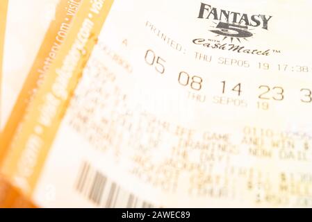 Vidalia, Georgia / USA - September 9, 2019: A close-up studio shot of the Georgia Fantasy 5 yellow lottery printout ticket. Stock Photo