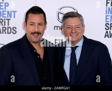 Los Angeles, USA. 28th Mar, 2023. MURDER MYSTERY 2 Cast & Crew - (Standing,  L-R) Jason Young, Ori Marmur, Zurin Villanueva, Ted Sarandos, Jodie  Turner-Smith, Adam Sandler, Scott Stuber, Jennifer Aniston, Jeremy