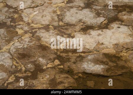 Stone texture close up. rocky wall background. abstract brown grunge texture Stock Photo