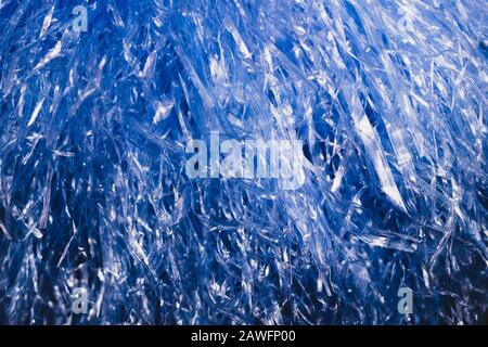 Abstract blue texture with wavy plastic stripes. blue tinsel macro Stock Photo