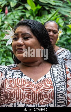 Kamokila Village, Kauai, Hawaii, USA. - January 16, 2020: Closeup of  female folk singer performing wedding song on stage in front of Fern Grotto. Gre Stock Photo