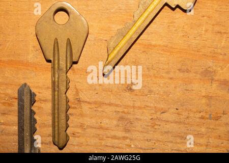 Different keys on wooden background. safety and security concept Stock Photo