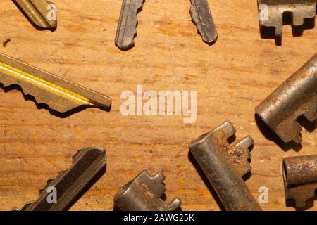 Different keys on wooden background. safety and security concept Stock Photo