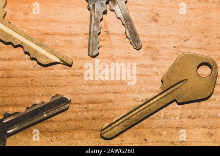 Different keys on wooden background. safety and security concept Stock Photo