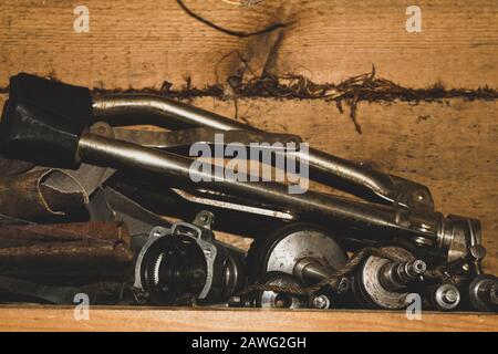 Various old tools in the workshop. chaos of working things. scrape metal Stock Photo