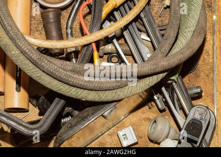 Various old rusty tools in the box. chaos of working things in workshop Stock Photo