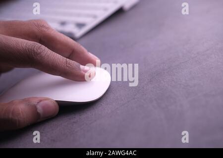 man hand use computer mouse on table , closeup  Stock Photo