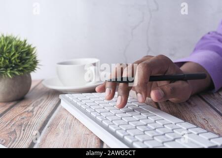 man hand typing on keyboard on office desk  Stock Photo