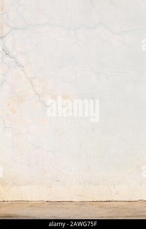 Cracked cement wall and floor, shot in vertical, showing cracked texture lines and color imperfection, good for background Stock Photo